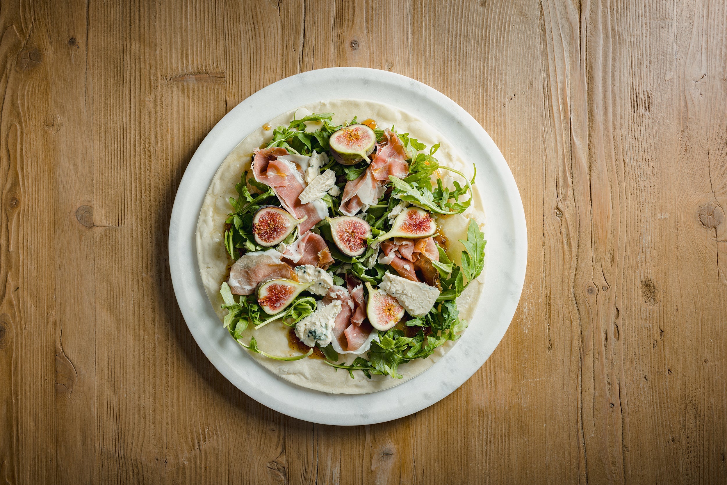 Fig & Onion Jam Flatbread with Bleu Cheese, Prosciutto, Arugula