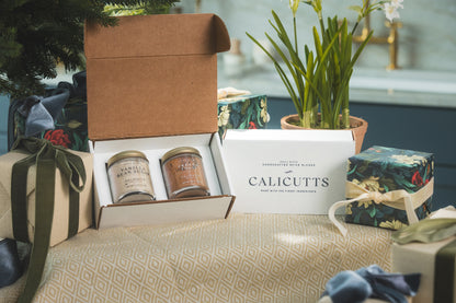 a box with jars and a box with a plant in it