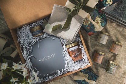 a box with a gift box and a box of jars